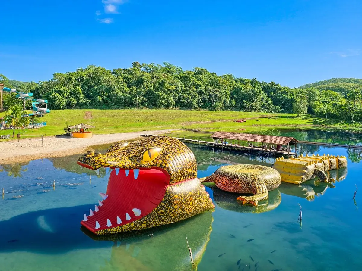Giant inflatable crocodile, the world's largest inflatable toy, on the lagoon at Praia da Figueira